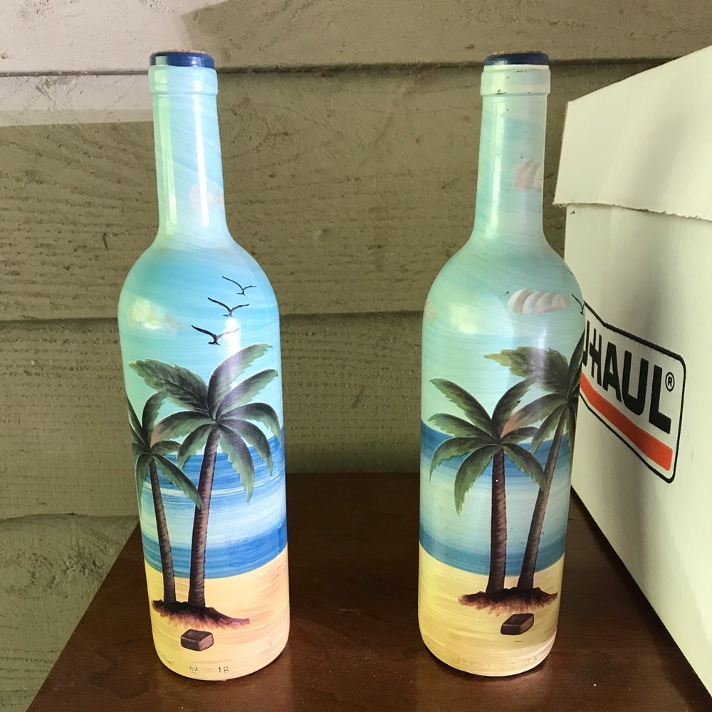 Two palm tree decor bottles